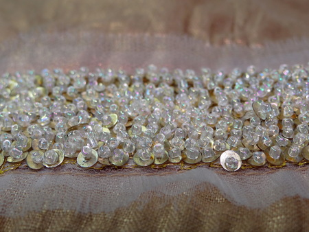 beads on gold fabricの写真素材