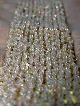 beads on gold fabricの写真素材
