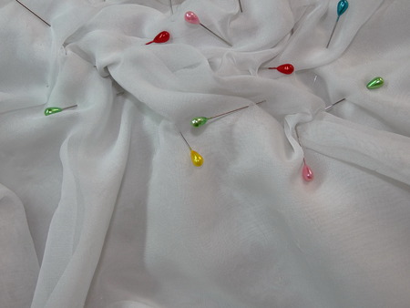 white fabric with needlesの写真素材