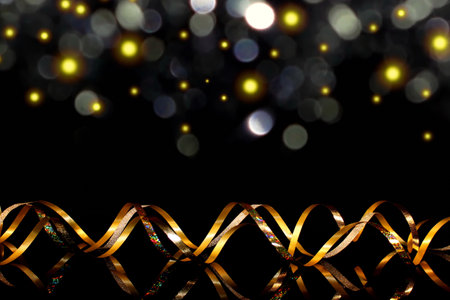 beautiful festive background, golden serpentine on a black backgroundの写真素材
