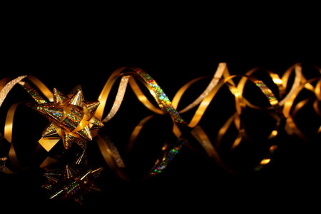 beautiful festive background, golden serpentine on a black backgroundの写真素材