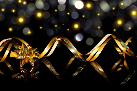 beautiful festive background, golden serpentine on a black backgroundの写真素材
