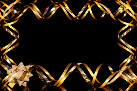 beautiful festive background, golden serpentine on a black backgroundの写真素材