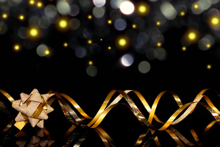 beautiful festive background, golden serpentine on a black backgroundの写真素材