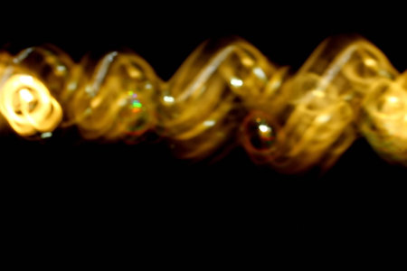 beautiful abstract golden background on black backgroundの写真素材