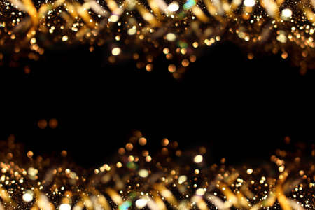 beautiful shiny gold background on a dark backgroundの写真素材