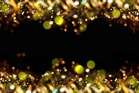 beautiful shiny gold background on a dark backgroundの写真素材