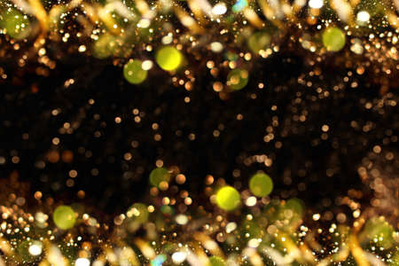 beautiful shiny gold background on a dark backgroundの写真素材