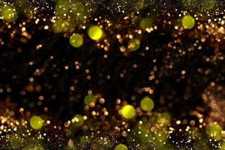 beautiful shiny gold background on a dark backgroundの写真素材