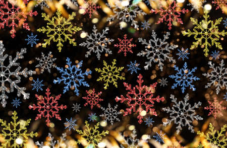 beautiful Christmas background with colorful snowflakes on a shiny backgroundの写真素材