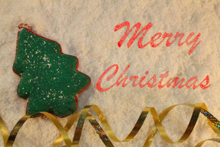 beautiful green Christmas tree lies on the white snowの写真素材