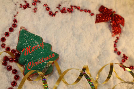 beautiful green Christmas tree lies on the white snowの写真素材