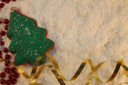 beautiful green Christmas tree lies on the white snowの写真素材