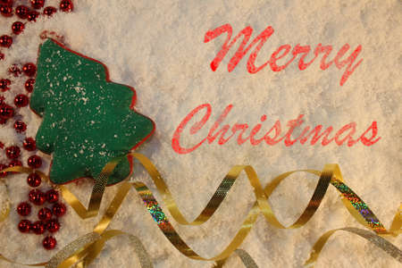 beautiful green Christmas tree lies on the white snowの写真素材