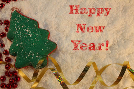 beautiful green Christmas tree lies on the white snowの写真素材
