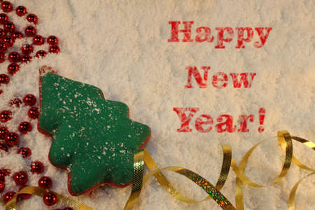 beautiful green Christmas tree lies on the white snowの写真素材