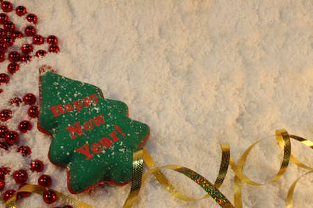 beautiful green Christmas tree lies on the white snowの写真素材