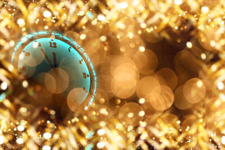 beautiful Christmas clock on a shiny gold background