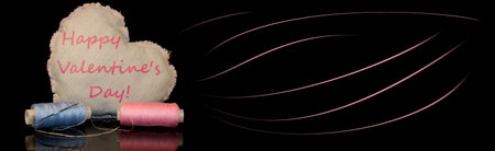 beautiful heart made of denim fabric on a black background with the inscription "Happy Valentine's Day"の写真素材