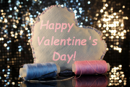 beautiful heart made of denim fabric on a shiny backgroundの写真素材