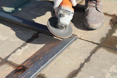 metal repair work with a grinder with beautiful sparksの写真素材