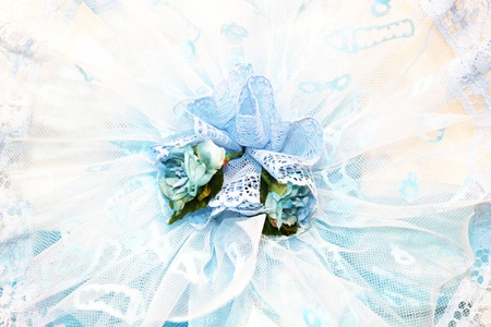 Blue ribbon celebrating a male newborn babyの写真素材