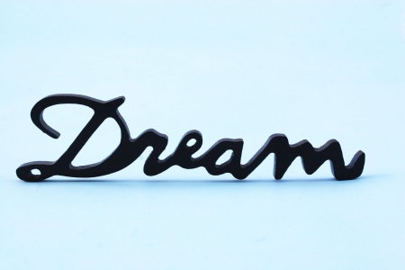 Close up of the word dream on a blue backgroundの写真素材