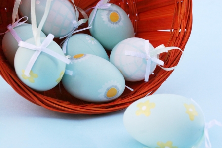 Tipical eastern eggs in a orange basketの写真素材