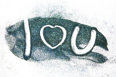 The word love you written on colored glitter powderの写真素材