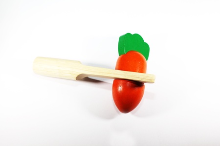 carrot orange colored wooden toy for babiesの写真素材
