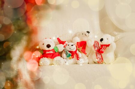 Coca Cola white Christmas bears sitting together with holiday lightsのeditorial素材