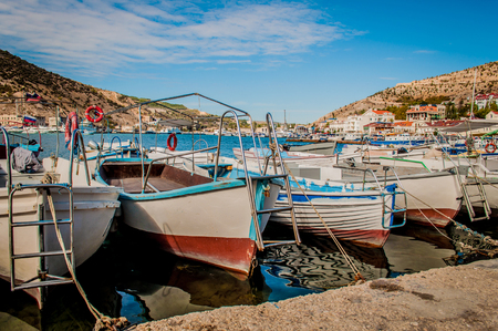 icturesque fishing boats on the pier at sunny day.の写真素材