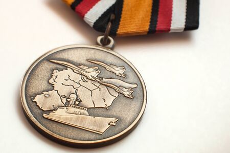 4 July 2019, Voronezh, Russia. Medal of Russian department of defence dedicated to members of the military operation in Syria. Front side close up.のeditorial素材