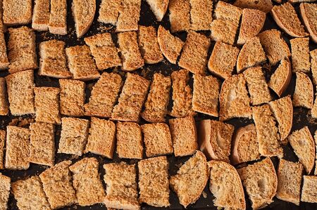Home cooked rusks on a pan just taken out of the ovenの写真素材