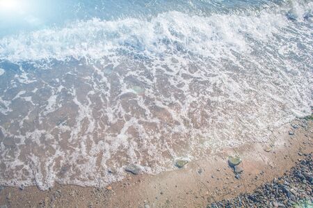 Blue sea water during sea surf. View from the top. Marine background.