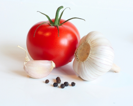 Red tomatos , garlic and pepperの写真素材