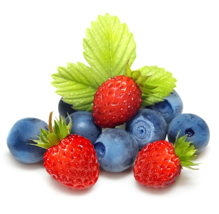 Wild strawberry and blueberry macro isolated on whiteの写真素材