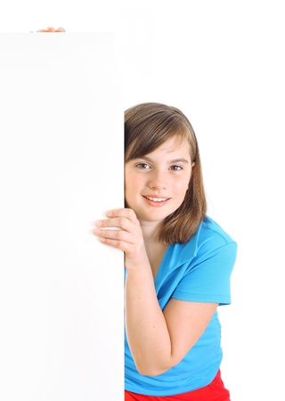 Happy girl beside a white blank with place for your text.の写真素材