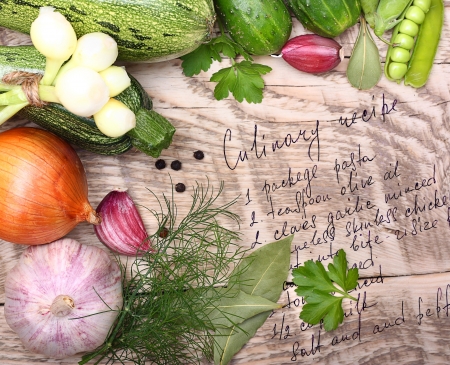 Vegetables, spices and cooking recipe drawing on wooden backgroundの写真素材