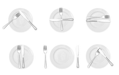 Plate with fork and knife isolated on white background.の写真素材