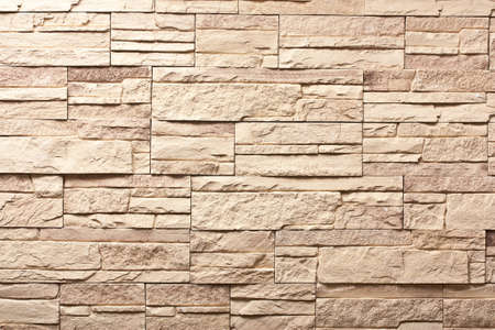 Decorative slate beige stone wall pattern, background.の写真素材