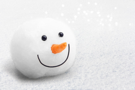 Snowman on snow background.の写真素材