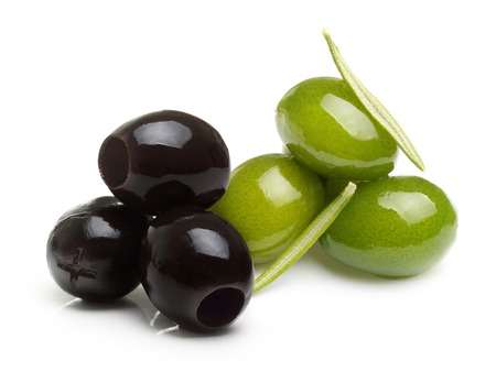 Green and black olives with leaves isolated on whiteの写真素材