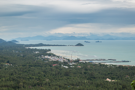 Dramatic stormy cloud sky above Nathon Pier of Koh Samui island, Thailand in turquoise sea. Tropical Storm Pabuk.の写真素材