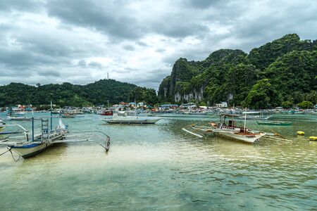 Traditional Boats and a Pier in El Nido, Palawan, Philippinesのeditorial素材