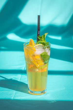 Glass of cold lemon ice tea Drink isolated on abstract blue background.の写真素材