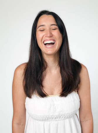 Woman laughing with eyes closedの写真素材