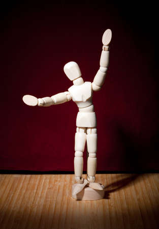 Artist's figure acting in spotlightの写真素材