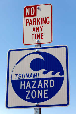 A road sign warning that the area is a Tsunami Hazard Zone. の写真素材