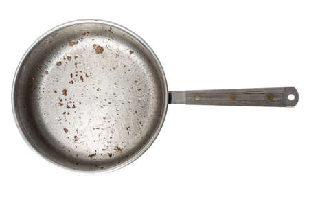 A frying pan with lots of grease and crumbs of ground beef, isolated on a pure white background の写真素材